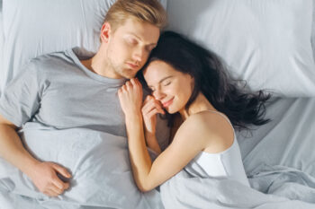 Cute,Young,Couple,Sweetly,Sleeping,In,The,Bed,,Tenderly,Cuddling